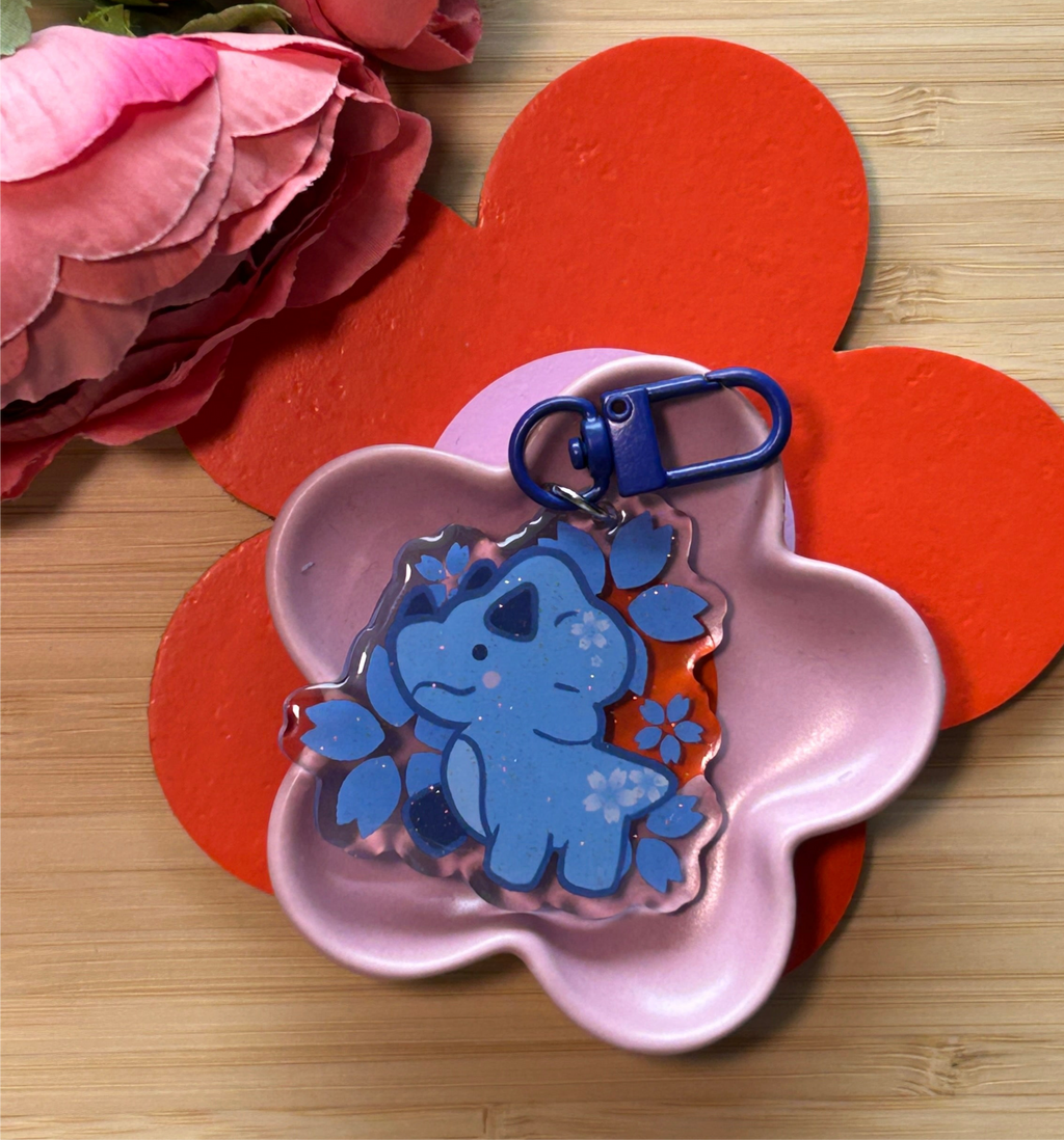 Acryl-Schlüsselanhänger mit Epoxidharz-Vorderseite – Blaue Sakura mit Dino (50,8 mm)